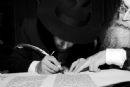 Rabbi Levi Raskin completing the final letters of the RSF Torah